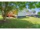 Charming backyard features a deck, patio, and lush lawn, creating an inviting outdoor retreat at 139 5Th St, Huntersville, NC 28078
