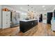Spacious kitchen with a large island, stainless steel appliances, and wood floors at 139 5Th St, Huntersville, NC 28078
