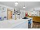 Open concept kitchen with a white sink and a gold faucet at 139 5Th St, Huntersville, NC 28078