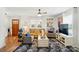 Sunlit living room features a cozy rug, wood floors, comfortable seating, and a decorative mirror at 139 5Th St, Huntersville, NC 28078