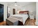 Comfortable main bedroom with a ceiling fan, black door, and neutral colors offers a relaxing retreat at 139 5Th St, Huntersville, NC 28078