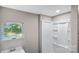 This is a well-lit bathroom featuring a window and a shower with clean lines at 143 Phifer Cir, Kings Mountain, NC 28086