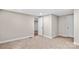 Bedroom with neutral walls, carpeted floors, white doors, and a view into a nearby room at 143 Phifer Cir, Kings Mountain, NC 28086