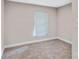This bedroom has neutral carpet, a window and white trim work that makes it feel calming at 143 Phifer Cir, Kings Mountain, NC 28086