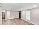 Spacious, open-concept living room with sleek wood-look flooring, neutral paint, and recessed lighting at 143 Phifer Cir, Kings Mountain, NC 28086