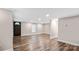 Bright living room featuring stylish wood floors, fresh paint, modern recessed lighting, and a half-light entry door at 143 Phifer Cir, Kings Mountain, NC 28086