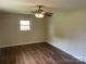 Cozy bedroom featuring hardwood floors, neutral walls, and a ceiling fan at 1824 Ebinport Rd, Rock Hill, SC 29732