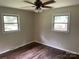 This bedroom features beautiful wood-look floors and great natural light from the two windows at 1824 Ebinport Rd, Rock Hill, SC 29732