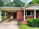 This charming brick home features a covered carport at 1824 Ebinport Rd, Rock Hill, SC 29732