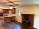 Open living space flows into the kitchen, highlighted by hardwood floors and a brick fireplace at 1824 Ebinport Rd, Rock Hill, SC 29732