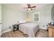 Charming bedroom with wood-look floors, natural light, and modern amenities at 18524 Mizzenmast Ave, Cornelius, NC 28031
