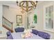 Cozy dining room with rustic chandelier, wainscoting, wood floors and lots of natural light at 18524 Mizzenmast Ave, Cornelius, NC 28031