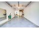 Spacious two-car garage with epoxy flooring and ample storage space at 18524 Mizzenmast Ave, Cornelius, NC 28031