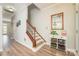 Hallway with wood floors and stairway at 18524 Mizzenmast Ave, Cornelius, NC 28031