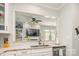 Modern kitchen featuring stainless appliances, granite counters, and stylish tile backsplash at 18524 Mizzenmast Ave, Cornelius, NC 28031