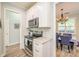 Modern kitchen featuring stainless appliances, granite counters, and stylish tile backsplash at 18524 Mizzenmast Ave, Cornelius, NC 28031