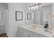 Clean bathroom with white vanity, framed art, and elegant fixtures at 202 Whitmyre Ct, Fort Mill, SC 29715