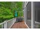 Relaxing deck area with a grill, umbrella, and sliding glass door access to the house at 202 Whitmyre Ct, Fort Mill, SC 29715