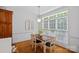 Cozy dining area with wood table, natural light, and charming decor at 202 Whitmyre Ct, Fort Mill, SC 29715