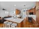 Modern kitchen with stainless steel appliances, quartz countertops, and a convenient breakfast bar at 202 Whitmyre Ct, Fort Mill, SC 29715