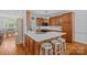 Beautiful kitchen with a large island, quartz countertops, stainless steel appliances, and wood cabinets at 202 Whitmyre Ct, Fort Mill, SC 29715