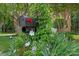 Charming mailbox adorned with climbing plants and flowers in a lovely yard at 202 Whitmyre Ct, Fort Mill, SC 29715