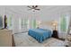 Serene main bedroom features tray ceilings, many windows, hardwood floors and a plush area rug at 202 Whitmyre Ct, Fort Mill, SC 29715
