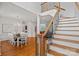 Elegant staircase with wrought iron railings, connecting to the dining and living spaces at 202 Whitmyre Ct, Fort Mill, SC 29715