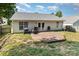 A patio and backyard, with a white house and fence at 228 Grayland Rd, Mooresville, NC 28115