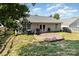 A backyard featuring a wood deck, with chairs and grill outside of the white vinyl-sided house at 228 Grayland Rd, Mooresville, NC 28115