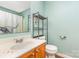 A clean bathroom with a stylish sink, shower, and towel rack offers organized convenience at 228 Grayland Rd, Mooresville, NC 28115