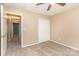 A simple bedroom with neutral carpet, white closet doors, and an adjoining hallway at 228 Grayland Rd, Mooresville, NC 28115