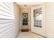 Close-up of the covered front porch, showcasing a decorated front door and a welcoming atmosphere at 228 Grayland Rd, Mooresville, NC 28115