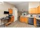 Efficient kitchen featuring wood-look flooring, cabinets, and a smooth transition to the living area at 228 Grayland Rd, Mooresville, NC 28115
