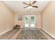 Bright living room boasts wood-look floors, a ceiling fan, and French doors that provide natural light at 228 Grayland Rd, Mooresville, NC 28115