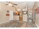 Inviting open floor plan with wood-look flooring seamlessly connecting the living and kitchen spaces at 228 Grayland Rd, Mooresville, NC 28115