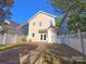Back of the home showing a patio and wooden deck at 240 Faust Rd, Davidson, NC 28036