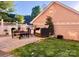 Inviting backyard patio with stylish outdoor seating and cafe lights next to a home at 240 Faust Rd, Davidson, NC 28036