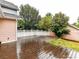 Backyard with a wood deck, patio and a white fence at 240 Faust Rd, Davidson, NC 28036