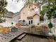 Outdoor backyard space with dining table, seating, fire pit, and lovely patio for relaxing and entertainment at 240 Faust Rd, Davidson, NC 28036