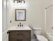 Bathroom with decorative light fixture and modern vanity at 240 Faust Rd, Davidson, NC 28036