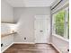Bedroom features wood floors, shelving and a window with an outdoor view at 240 Faust Rd, Davidson, NC 28036