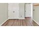 Bedroom features wood floors and a closet with double doors at 240 Faust Rd, Davidson, NC 28036