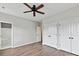 Bedroom with hardwood floors, ceiling fan, closet, and attached bathroom at 240 Faust Rd, Davidson, NC 28036