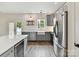 Beautiful open kitchen with modern appliances, island, and access to outdoor space at 240 Faust Rd, Davidson, NC 28036