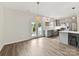 Modern kitchen with gray cabinets, stainless steel appliances, and an open layout to the dining area at 240 Faust Rd, Davidson, NC 28036