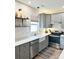 Modern kitchen features gray cabinets, stainless steel appliances, and white subway tile at 240 Faust Rd, Davidson, NC 28036