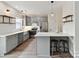 Modern kitchen with stainless steel appliances, grey cabinets, and center island with seating at 240 Faust Rd, Davidson, NC 28036