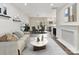 Cozy living room with stylish furniture, decor, and a seamless flow into the dining and kitchen areas at 240 Faust Rd, Davidson, NC 28036