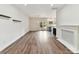 Open-concept living area showcasing hardwood floors, fireplace, and access to the modern kitchen at 240 Faust Rd, Davidson, NC 28036